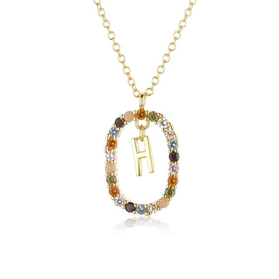 Necklace with a gold pendant featuring the letter 'H' on a white background
