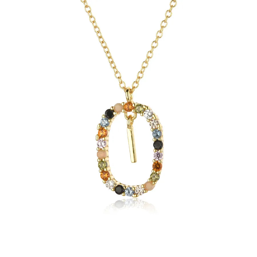 Gold necklace with multicolored gemstones on a white background