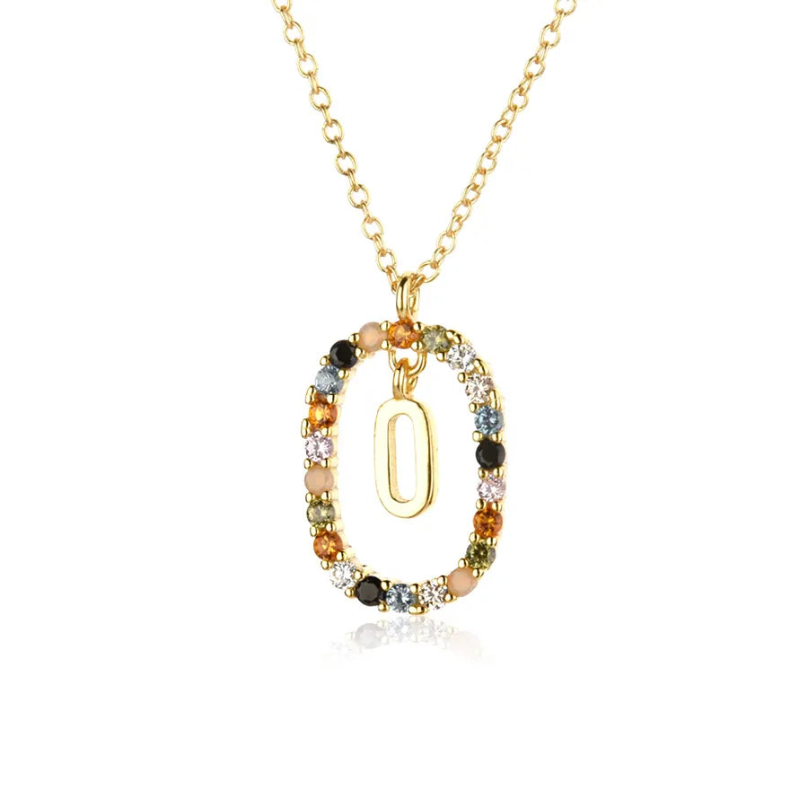Gold necklace with a pendant featuring multicolored beads on a white background