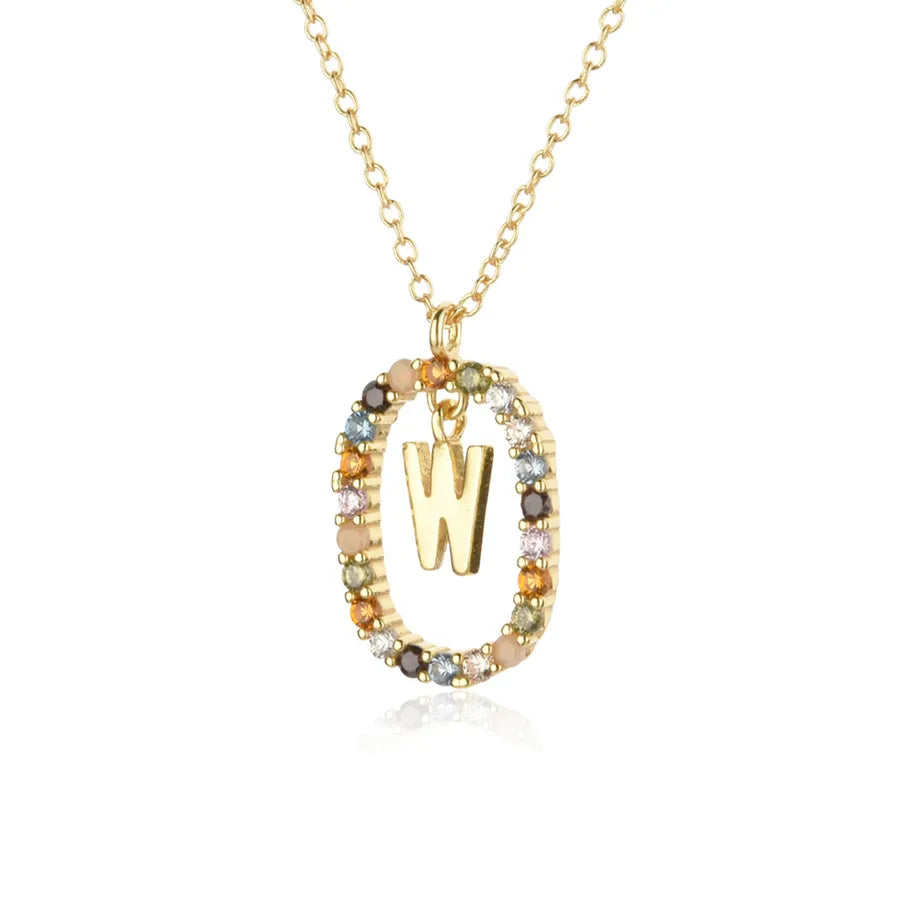 Gold necklace with a letter 'W' pendant on a white background
