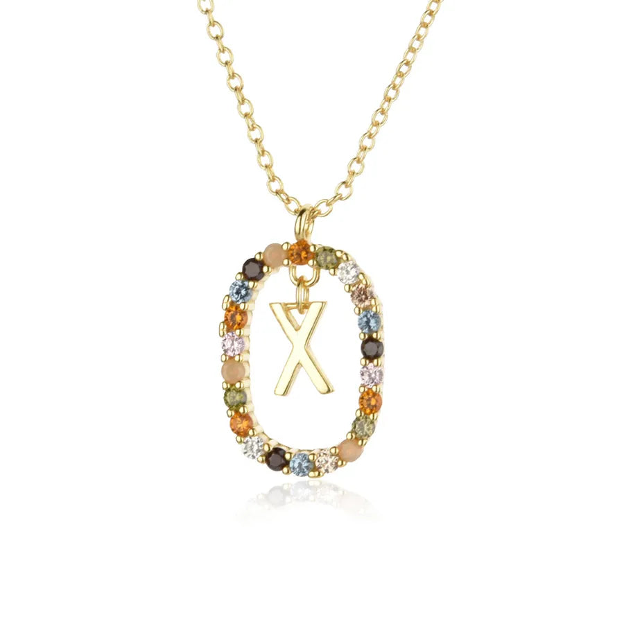Necklace with a gold pendant featuring a letter 'X' and multicolored beads on a white background