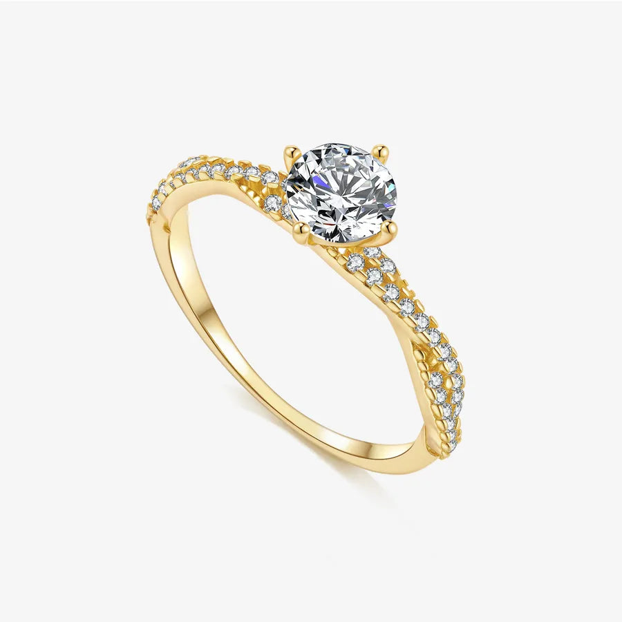 Gold ring with a diamond on a white background