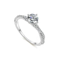 Silver ring with a diamond on a white background