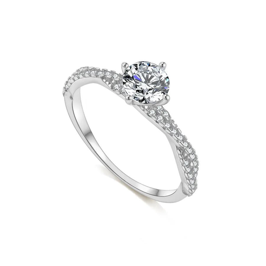 Silver ring with a diamond on a white background