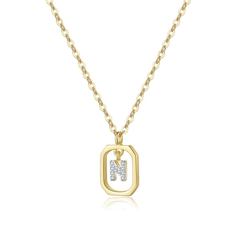 Gold necklace with a pendant on a white background, featuring a '925' stamp.