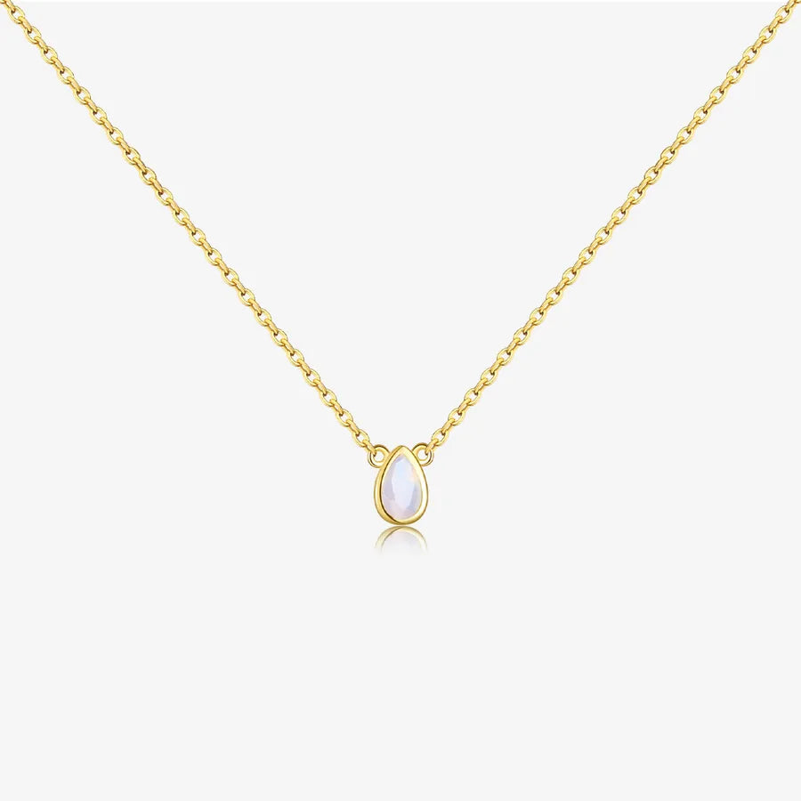 Gold necklace with a teardrop-shaped pendant on a white background