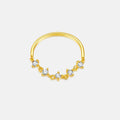 Gold ring with small diamonds on a light gray background
